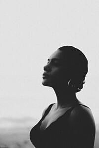 Profile of a woman against a misty background.