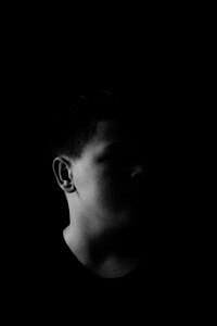 Silhouette of a person in darkness.