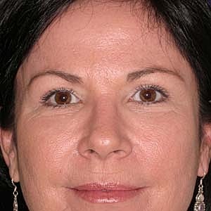 Close-up of a woman with dark hair.