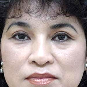 Close-up portrait of a woman with dark hair.