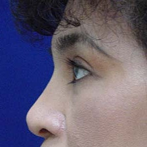 Close-up portrait of a woman with dark hair.