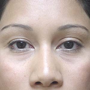 Close-up portrait of a woman with dark hair.