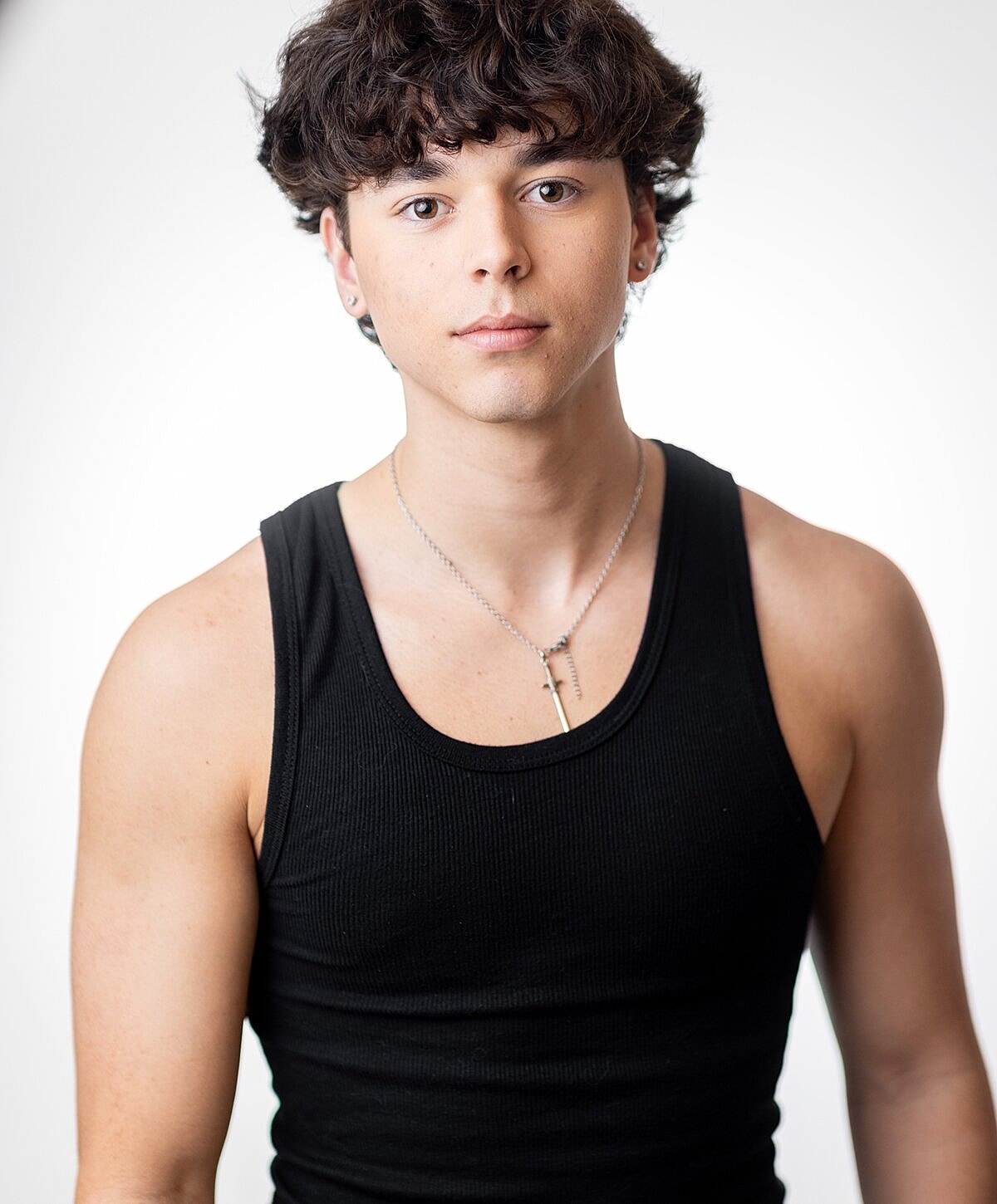 Young man in a black tank top.
