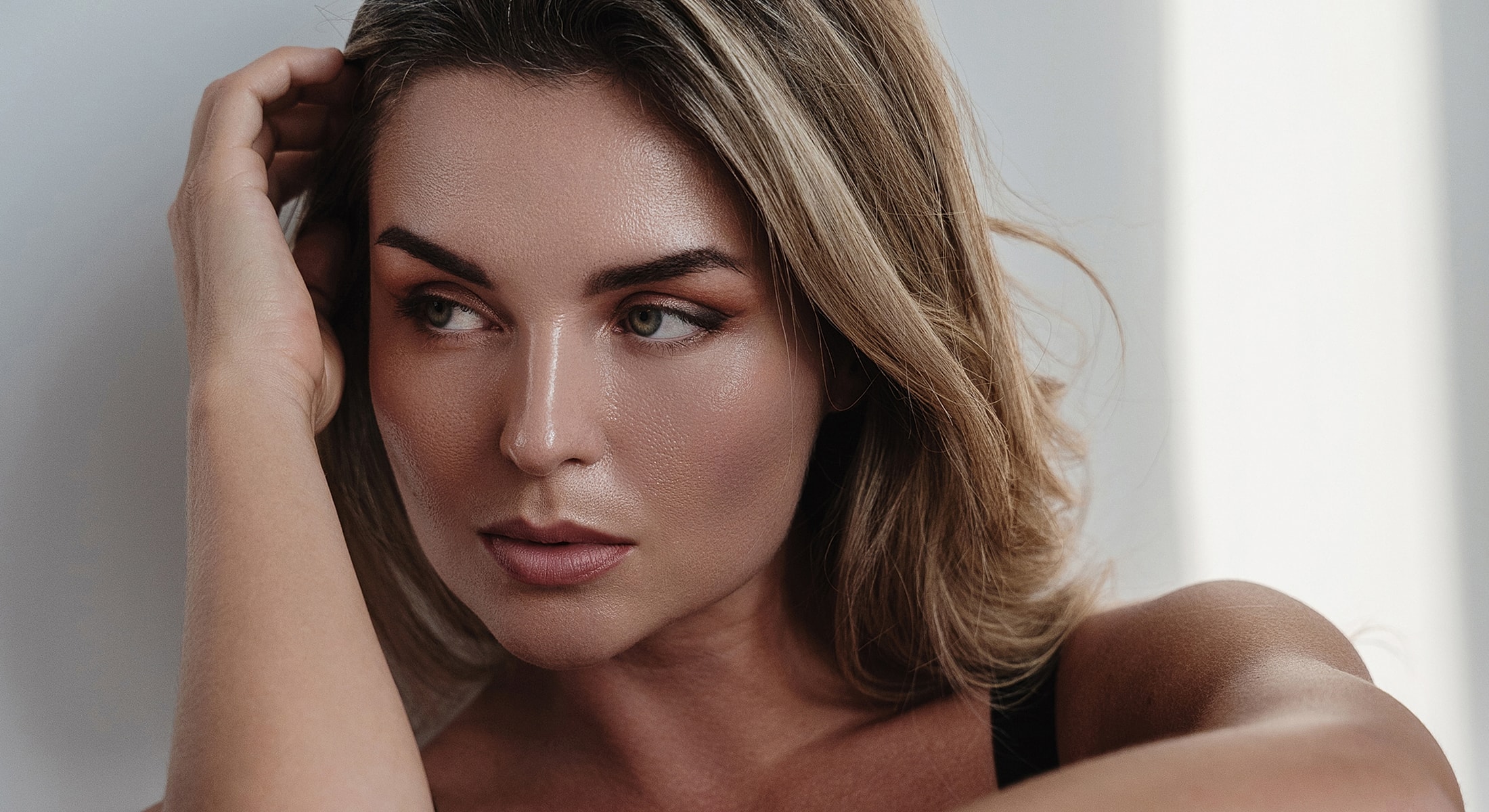 Close-up portrait of a woman looking contemplative.