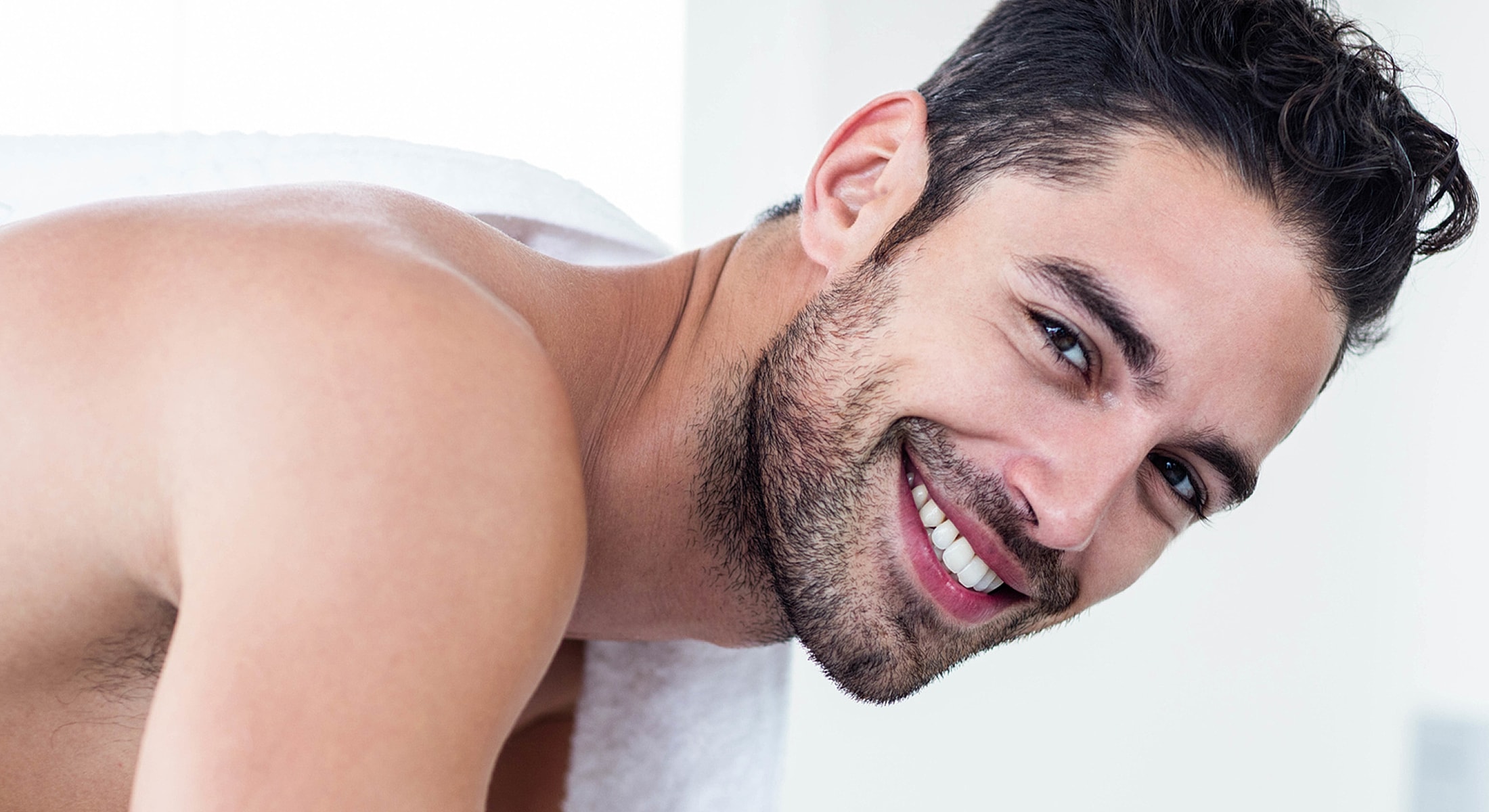 Smiling man in a professional setting.